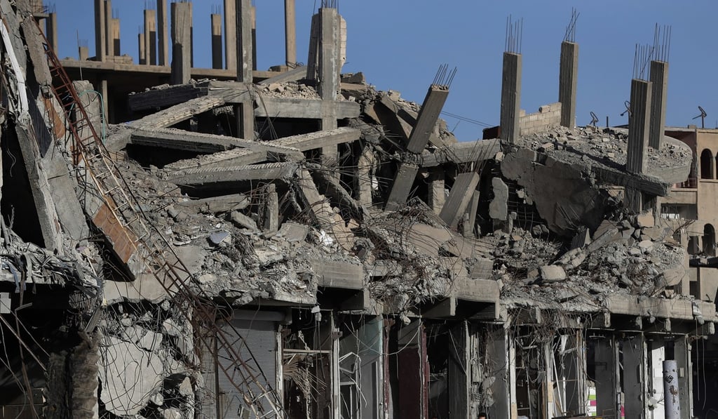 Destroyed buildings line a street damaged during fighting between US-backed Syrian Democratic Forces fighters and Islamic State militants, in Raqqa. Photo: AP Photo Destroyed buildings line a street damaged during fighting between US-backed Syrian Democratic Forces fighters and Islamic State militants, in Raqqa. Photo: AP Photo