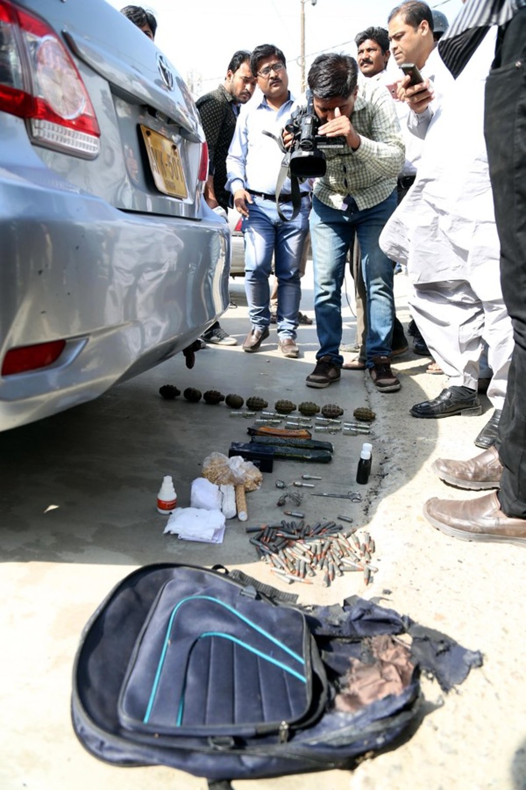Explosives recovered from a bag are displayed after the attack on the Chinese consulate in Karachi. Photo: EPA