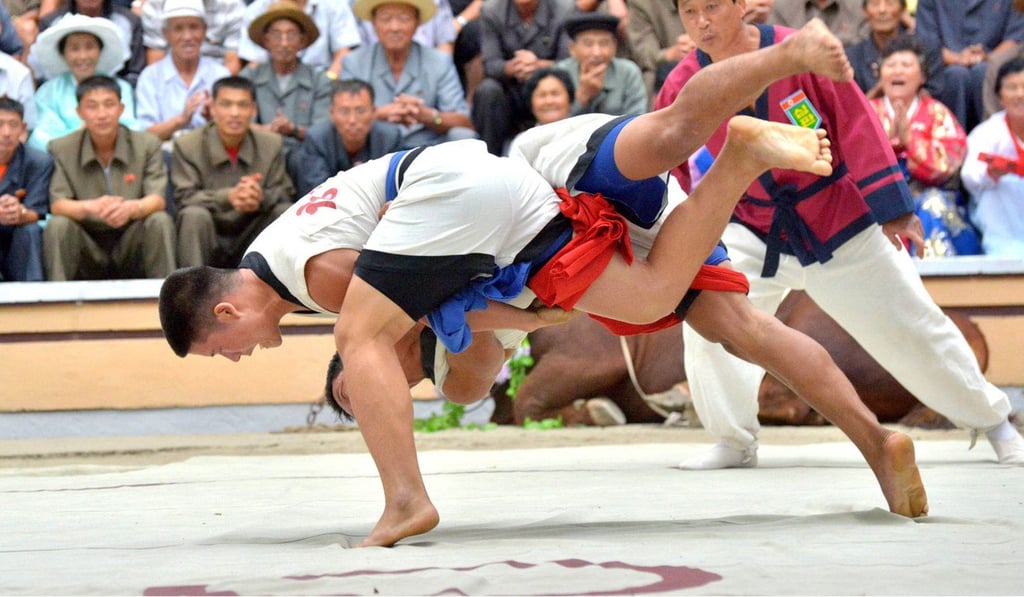 In the North, wrestlers don sleeveless jackets. Photo: EPA In the North, wrestlers don sleeveless jackets. Photo: EPA