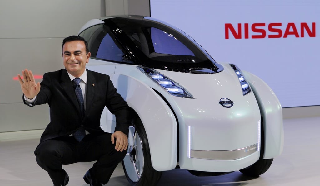 Former Nissan chairman Carlos Ghosn poses with a vehicle at the 41st Tokyo Motor Show. Photo: AP