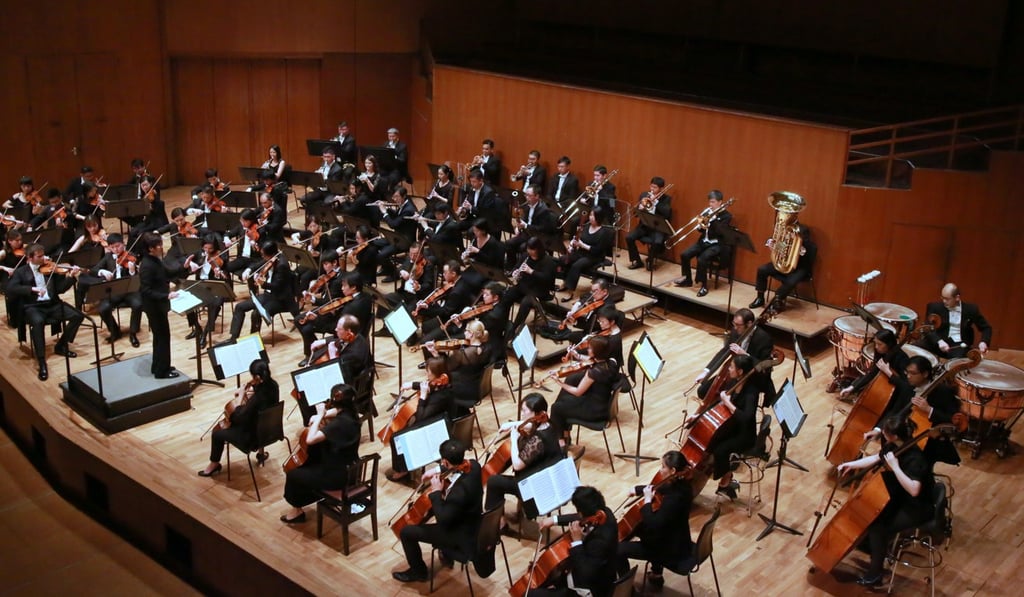 Yip Wing-sie conducting the Hong Kong Sinfonietta at Hong Kong City Hall, its home venue.