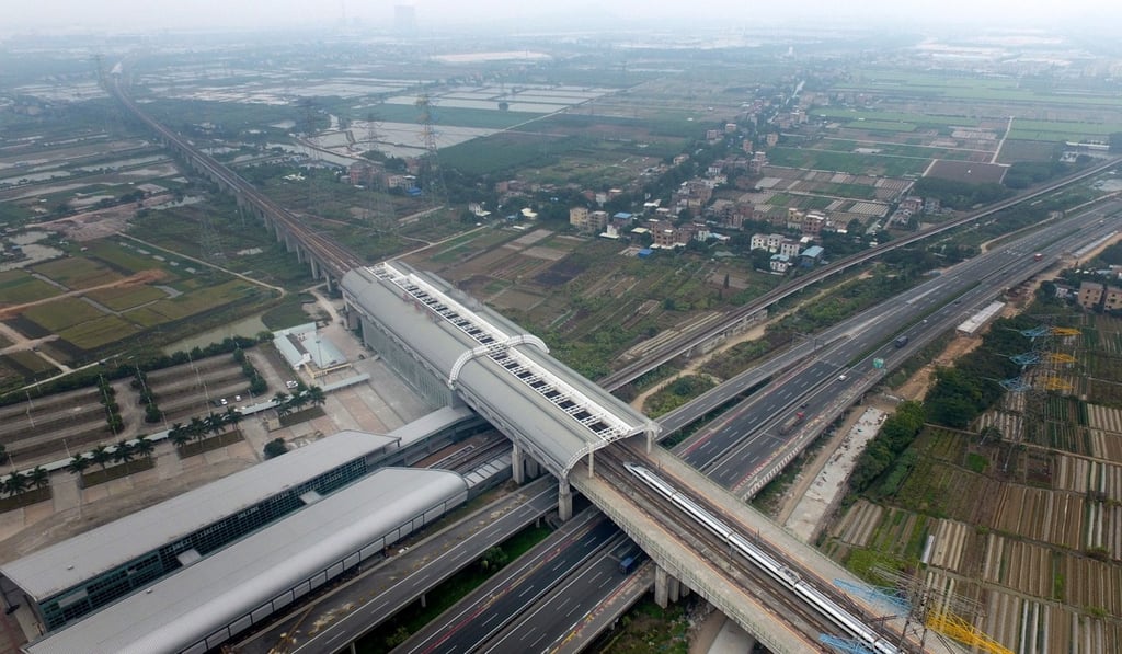 A bullet train enters the Qingsheng Station of the Guangzhou-Shenzhen-Hong Kong Express Rail Link in Guangzhou. A former top Shenzhen official has advocated the free flow of captial and movement in the Greater Bay Area. Photo: Xinhua A bullet train enters the Qingsheng Station of the Guangzhou-Shenzhen-Hong Kong Express Rail Link in Guangzhou. A former top Shenzhen official has advocated the free flow of captial and movement in the Greater Bay Area. Photo: Xinhua