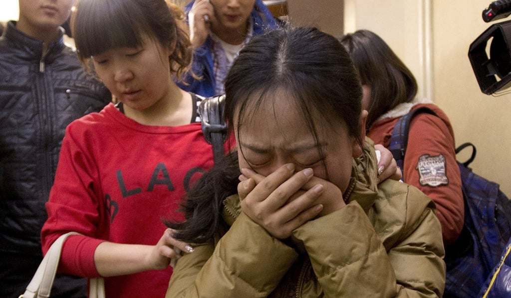 A grieving relative of a Chinese passenger. Photo: AP