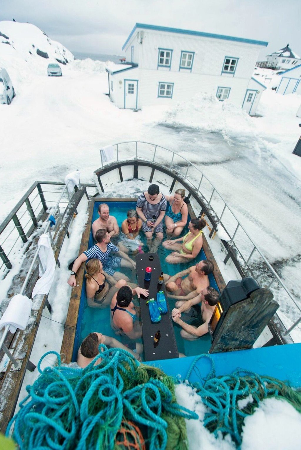 The ski party enjoys the hot tub at the Hamn i Senja Lodge.