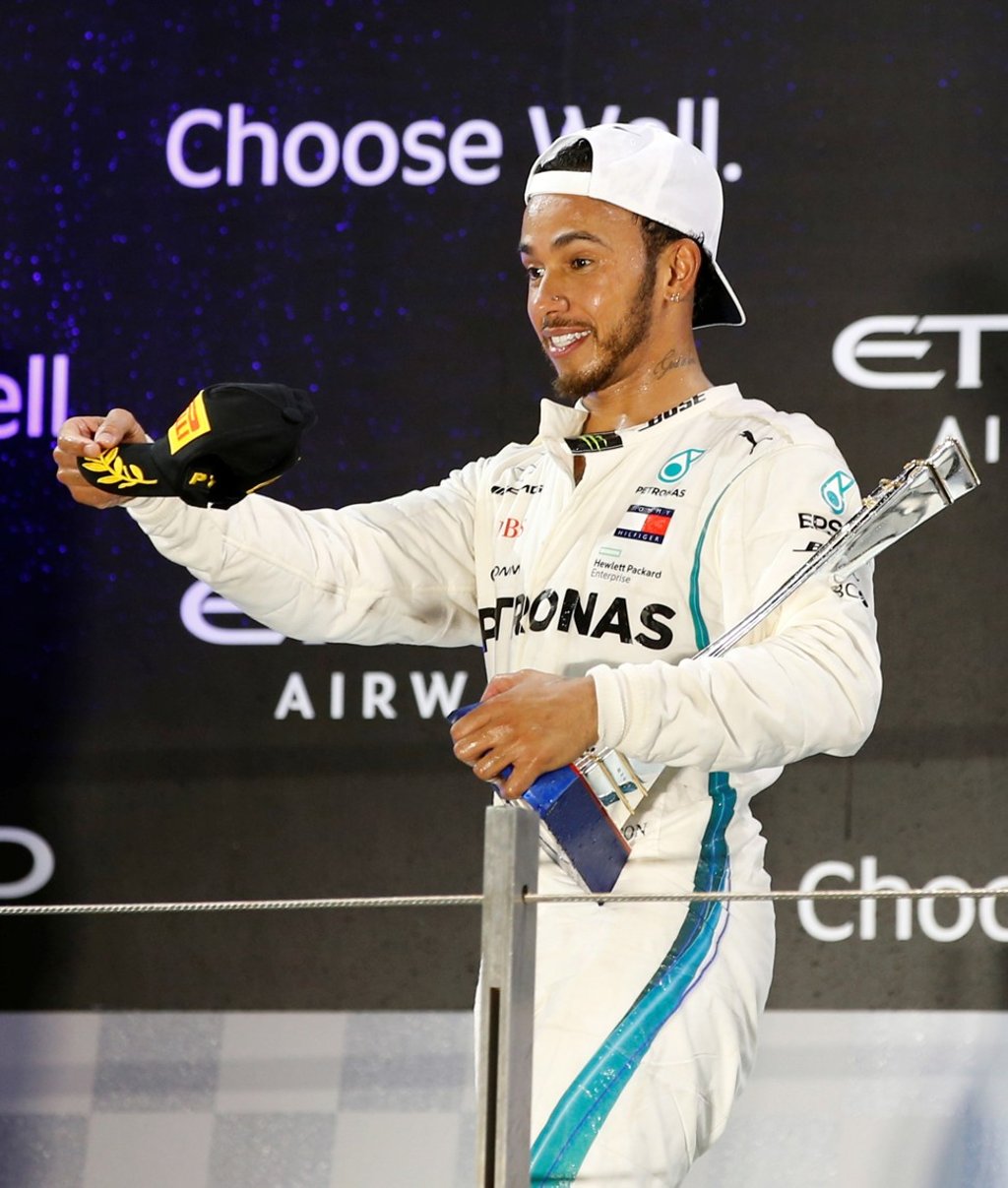 Lewis Hamilton, the British Formula One driver, holds the winner’s trophy as he celebrates victory at Sunday’s Abu Dhabi Grand Prix in the United Arab Emirates. Photo: EPA-EFE Lewis Hamilton, the British Formula One driver, holds the winner’s trophy as he celebrates victory at Sunday’s Abu Dhabi Grand Prix in the United Arab Emirates. Photo: EPA-EFE