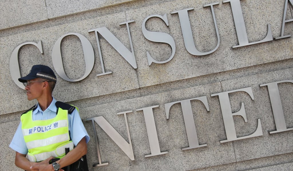 Police stand guard outside the US Consulate General in Central in June 2013. Photo: David Wong