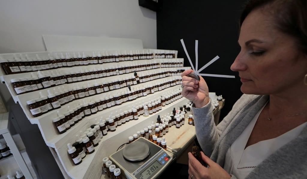 Perfumer Jessica Buchanan smells testers with the essences of plants in her shop in Grasse, France. Photo: Reuters