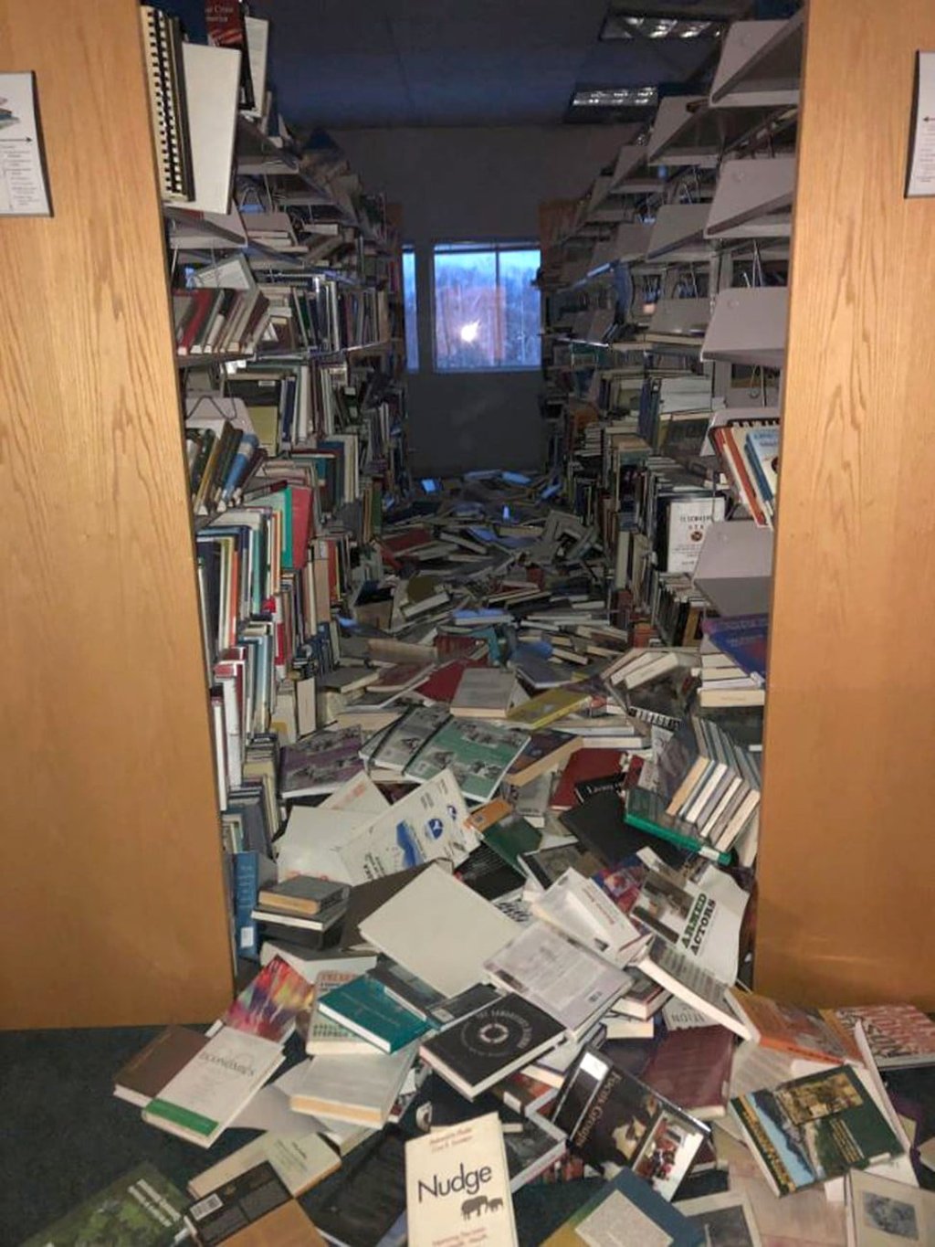 Books and ceiling tiles litter the floor at the The Mat-Su College library in Anchorage, Alaska, after Friday’s quakes. Photo: AFP