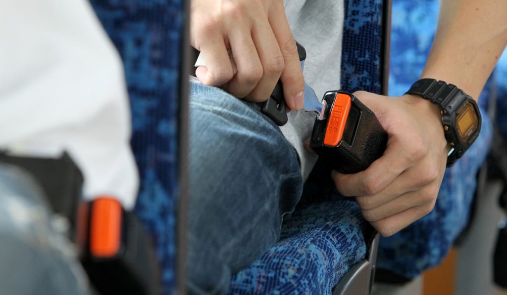 Operators will post notices on coaches to remind passengers to wear a seat belt. Photo: SCMP