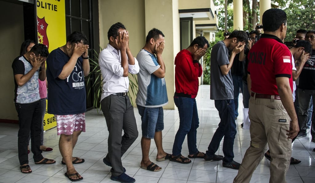 Indonesian police paraded a group of men arrested for allegedly holding a ‘gay party’ in Surabaya, the second biggest city in Indonesia, the world's most populous Muslim-majority country, in 2017. Photo: AFP
