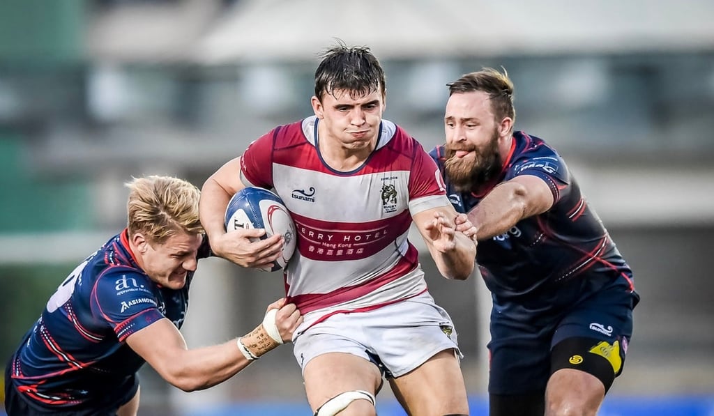 Kerry Hotel Kowloon James Sawyer breaks two tackles against HK Scottish.