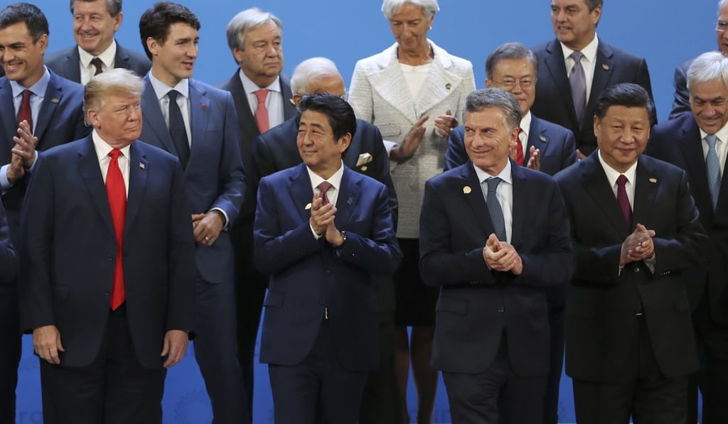 (From left) US President Donald Trump, Japanese Prime Minister Shinzo Abe, Argentine President Mauricio Macri and Chinese President Xi Jinping gather for a group photo at the start of the summit. Photo: AP (From left) US President Donald Trump, Japanese Prime Minister Shinzo Abe, Argentine President Mauricio Macri and Chinese President Xi Jinping gather for a group photo at the start of the summit. Photo: AP