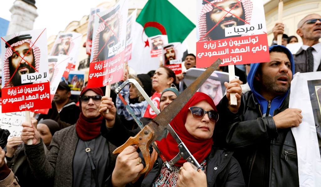 A woman takes part in a protest opposing the visit of Saudi Arabia's Crown Prince Mohammed bin Salman in Tunis, Tunisia. Photo: Reuters