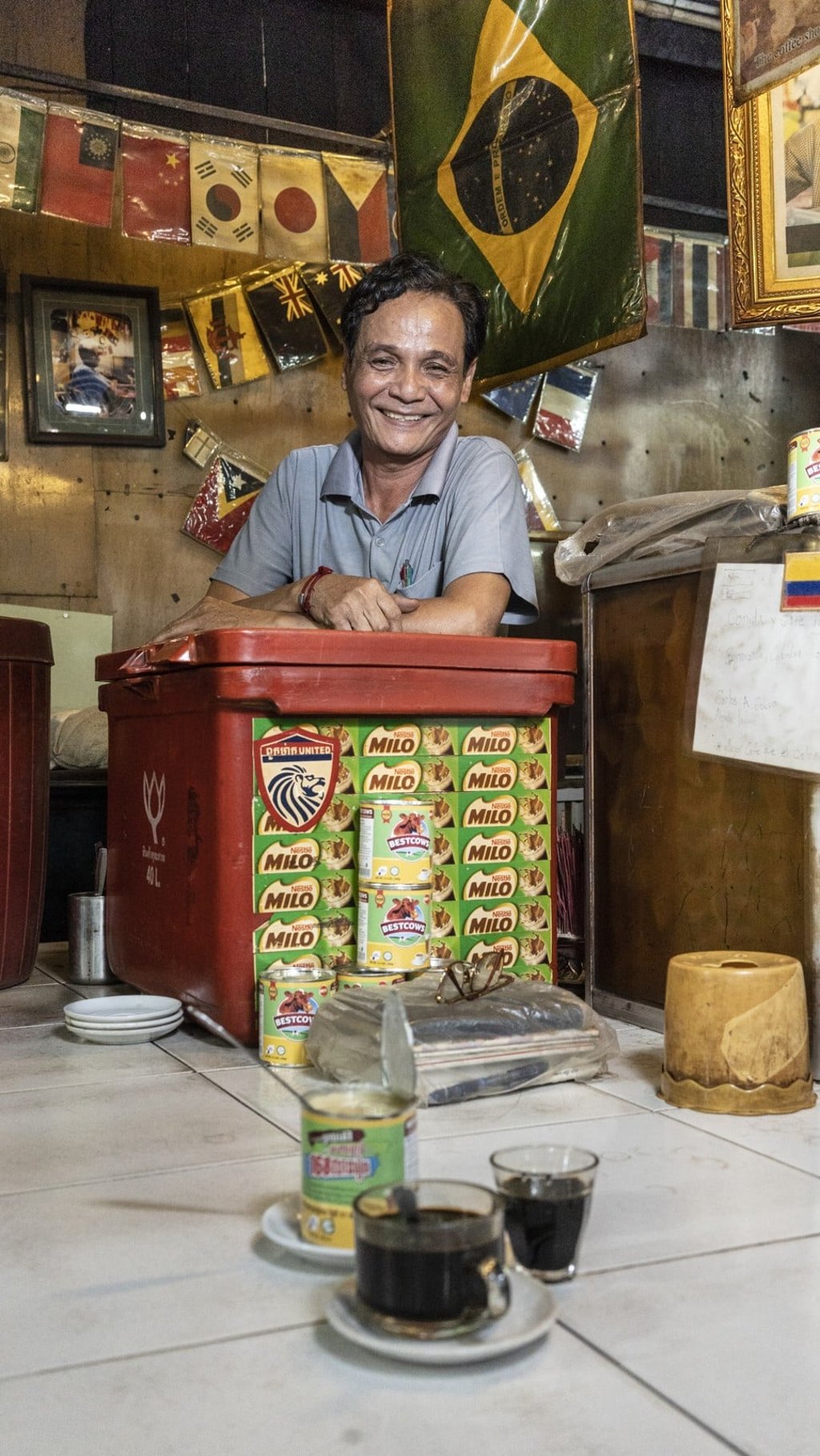 Ai Bounnareth has had a cafe stand inside Russian market since 1981. Photo: Enric Catala