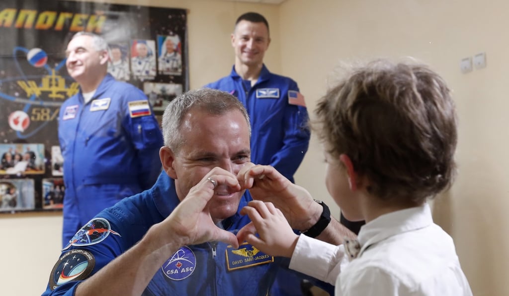 Member of the International Space Station (ISS) expedition 58/59, CSA astronaut David Saint-Jacques chats with his son after a press conference at the Baikonur cosmodrome, in Kazakhstan, 02 December 2018. Photo: EPA-EFE Member of the International Space Station (ISS) expedition 58/59, CSA astronaut David Saint-Jacques chats with his son after a press conference at the Baikonur cosmodrome, in Kazakhstan, 02 December 2018. Photo: EPA-EFE