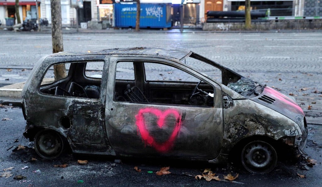 A picture shows a burned car in a street in Paris on December 2, 2018. Photo: AFP