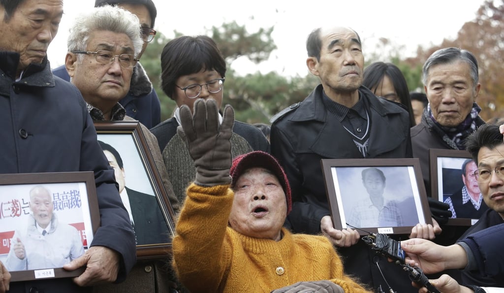 A victim of Japan's forced labour and her supporters speaks outside the Supreme Court in Seoul. Photo: AP