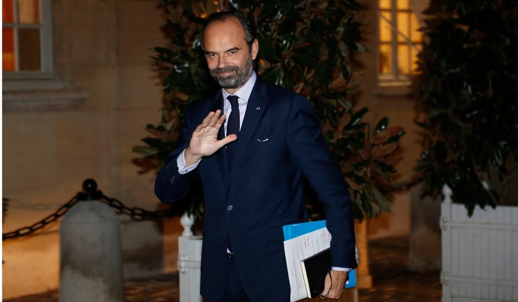 French Prime Minister Edouard Philippe waves as he meets parties and protest movement leaders on December 3, 2018 at the Hotel Matignon in Paris. Photo: AFP