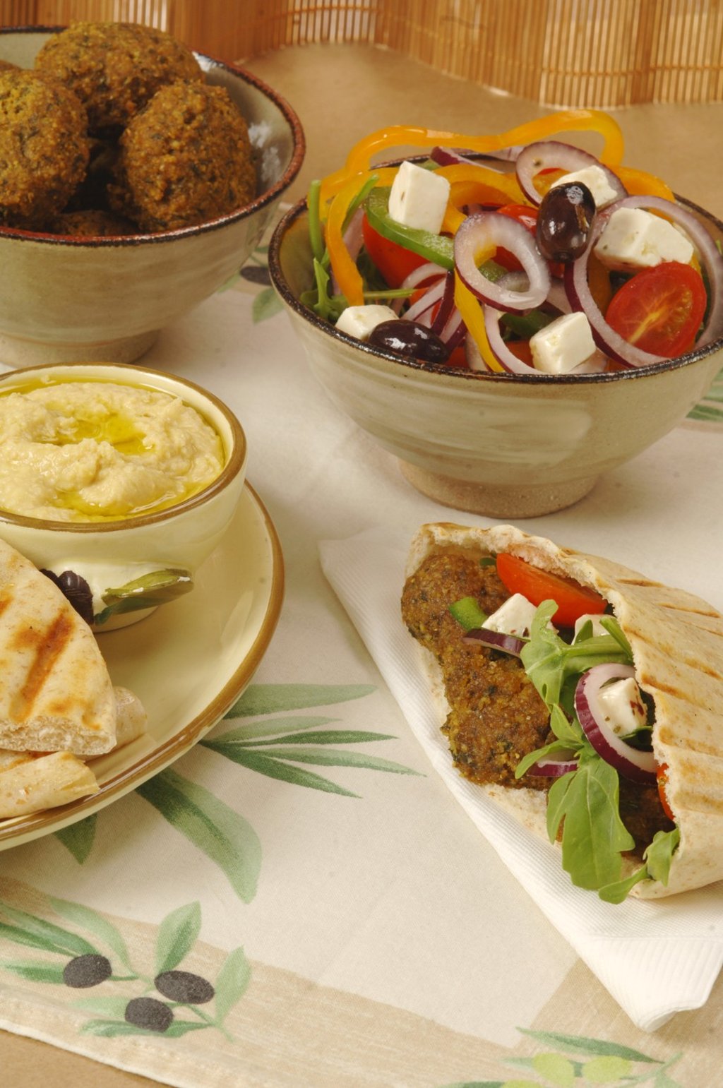 Falafel in pita bread with side salad and hummus. Photo: Koji Studio
