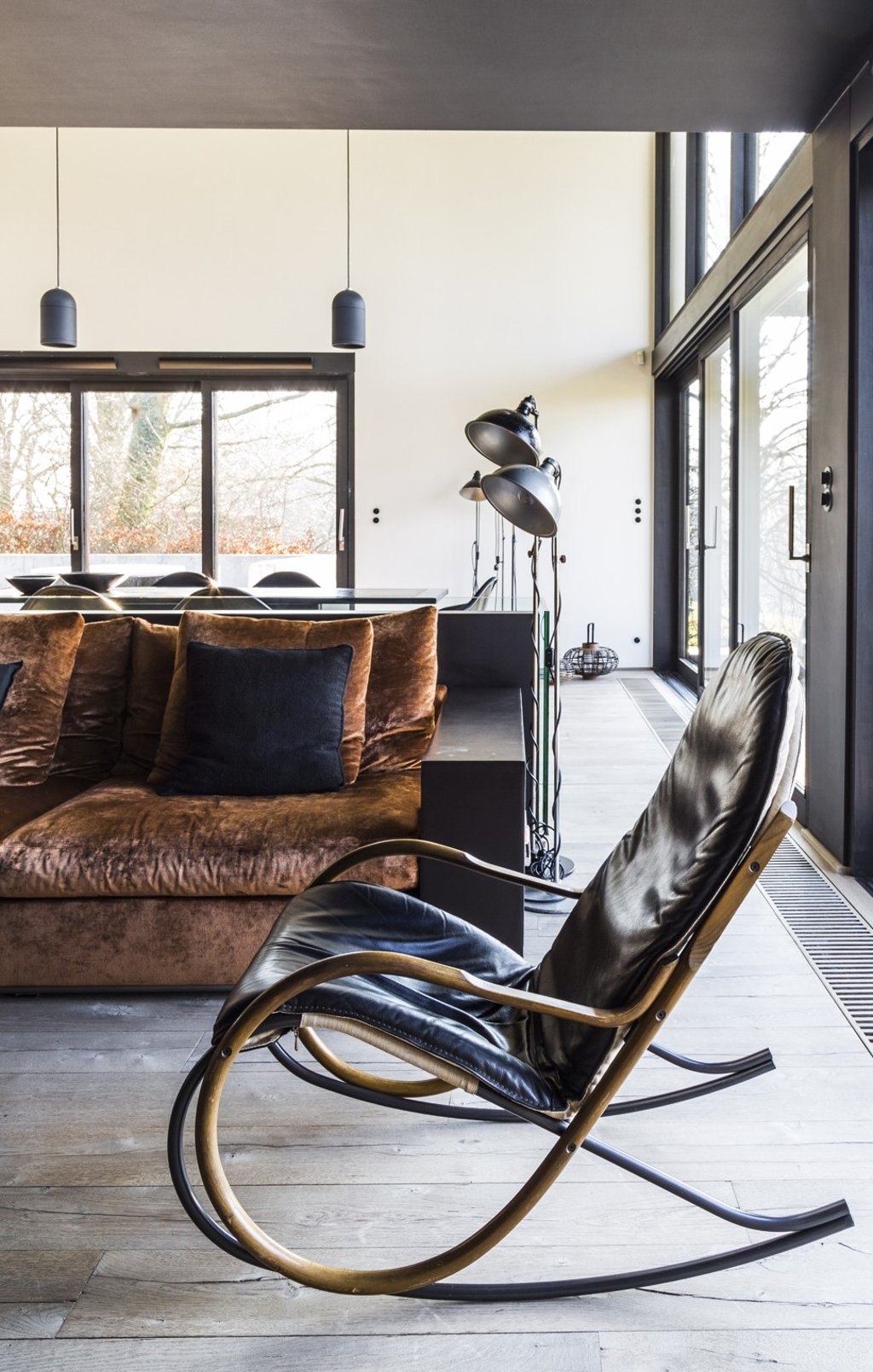 Dark woods and lush materials feature throughout the interior.