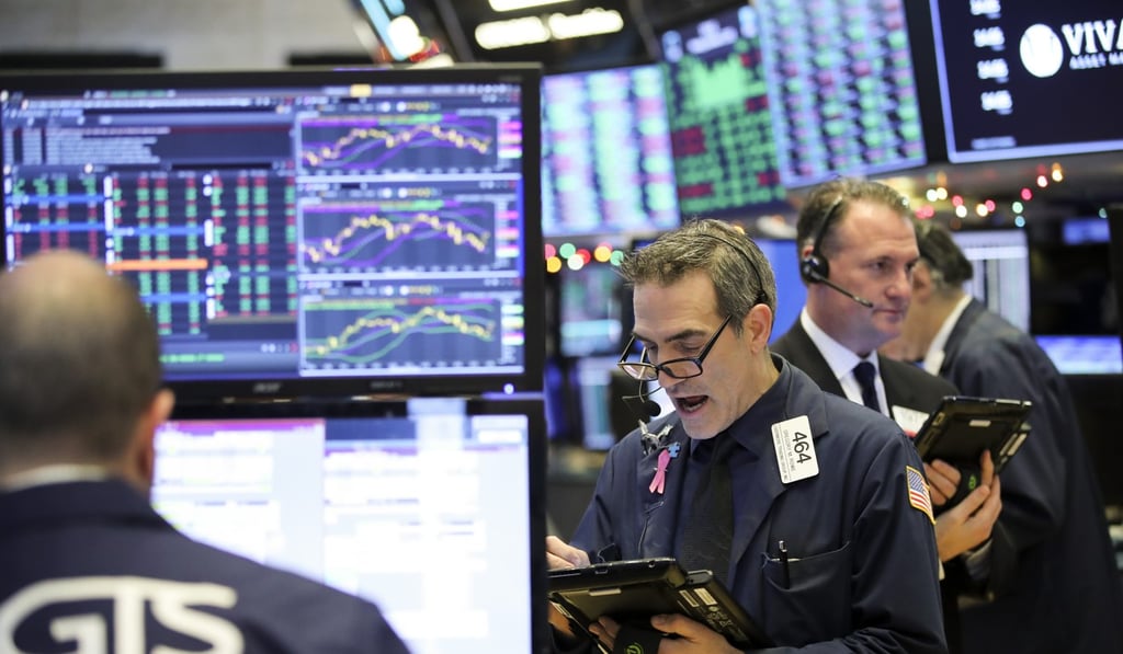 Traders work at the New York Stock Exchange. Photo: Xinhua