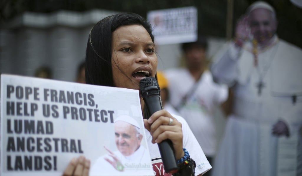 A Lumad activist petitions Pope Francis during his visit in 2015. Photo: AP