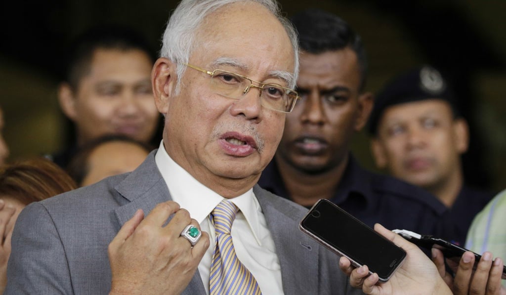 A published article claimed Malaysia’s disgraced former prime minister Najib Razak had dealt with Lee to secure Singapore banks’ help in connection with the 1MDB financial scandal. Photo: Bloomberg