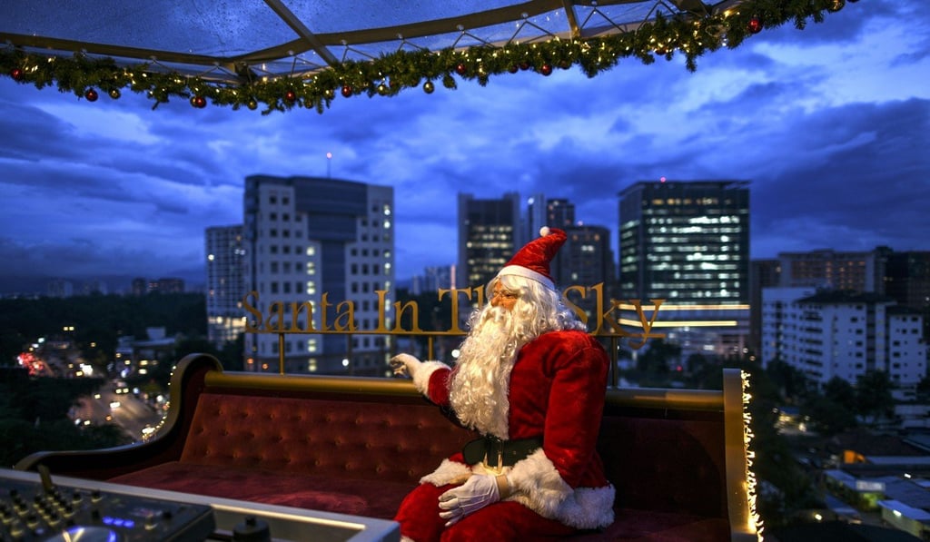 A Santa Claus mannequin sits on a couch in the hanging restaurant. Photo: AFP