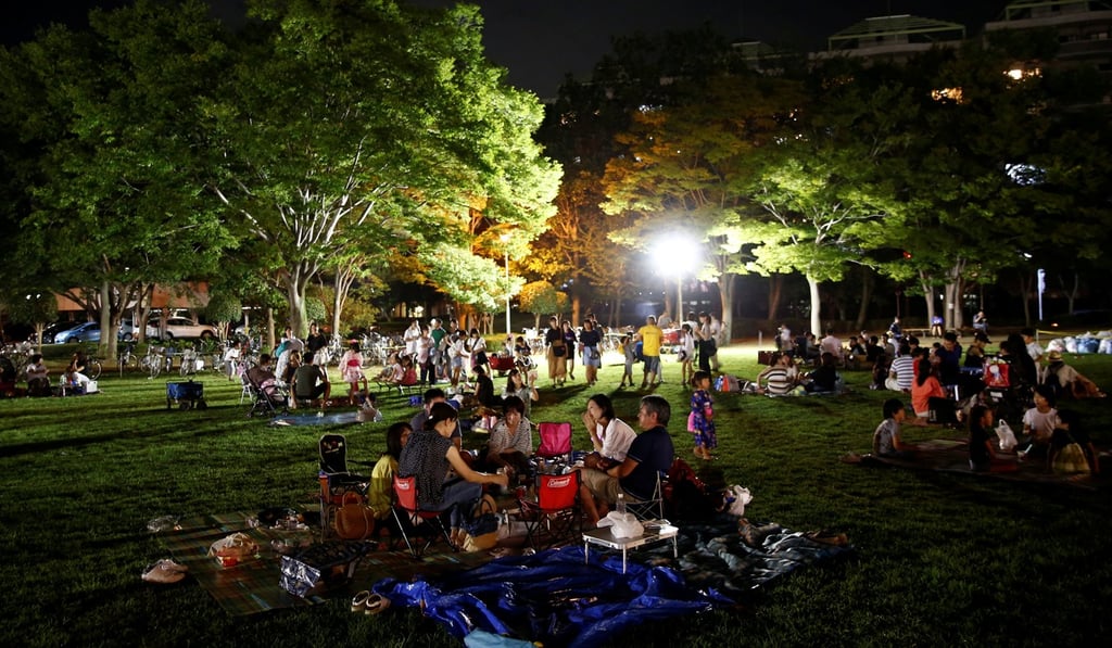Residents have picnics during the Matsuri festival in Inzai. Photo: Reuters