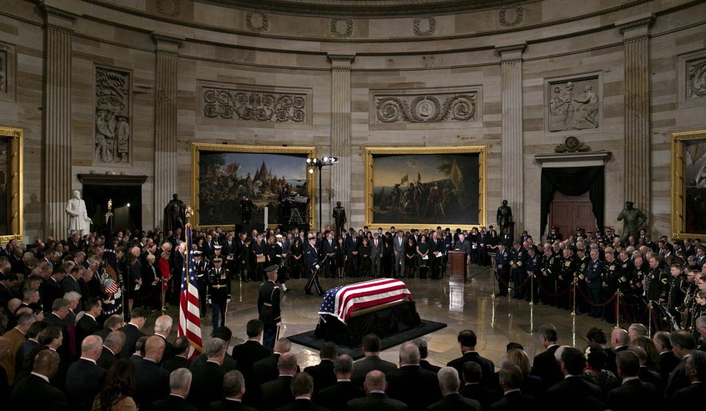 Former US president George H.W. Bush lies in state during a memorial service at the Capitol Rotunda in Washington on Monday. Photo: Bloomberg Former US president George H.W. Bush lies in state during a memorial service at the Capitol Rotunda in Washington on Monday. Photo: Bloomberg