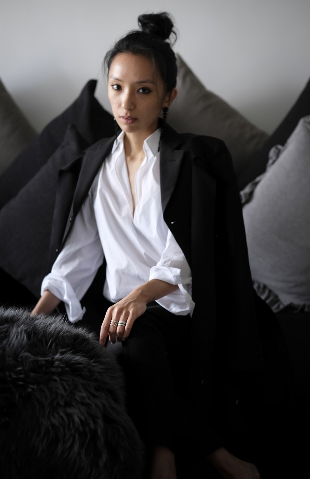 Au wears a jacket by Comme des Garcons, shirt by Acne Studios, trousers by Leal Daccarett and earrings by Simone Rocha. Photo: James Wendlinger
