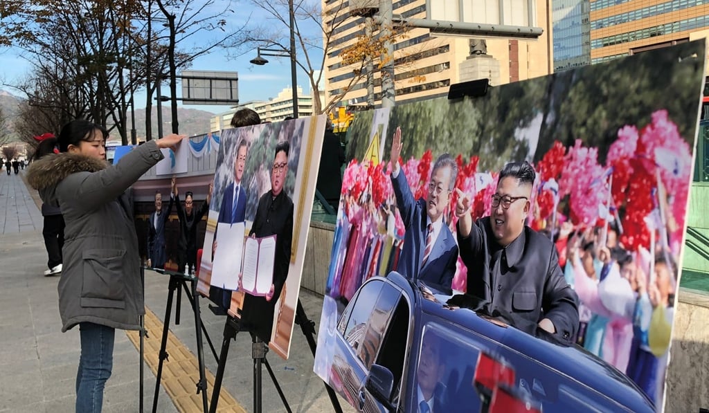 Pictures showing South Korean President Moon Jae-in and North Korean leader Kim Jong-un on display in Seoul. Photo: Reuters