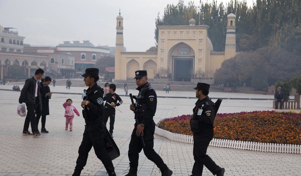 Uygur security personnel patrol near the Id Kah Mosque in Kashgar in the north-western Chinese Xinjiang region, in November 2017. Photo: AP