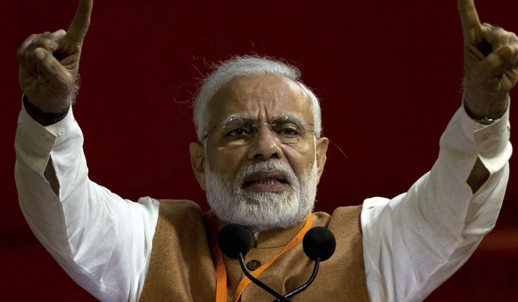 Indian Prime Minister Narendra Modi gestures as he speaks during an election campaign rally in Hyderabad, India, ahead of the November 7 elections. Photo: AP Indian Prime Minister Narendra Modi gestures as he speaks during an election campaign rally in Hyderabad, India, ahead of the November 7 elections. Photo: AP