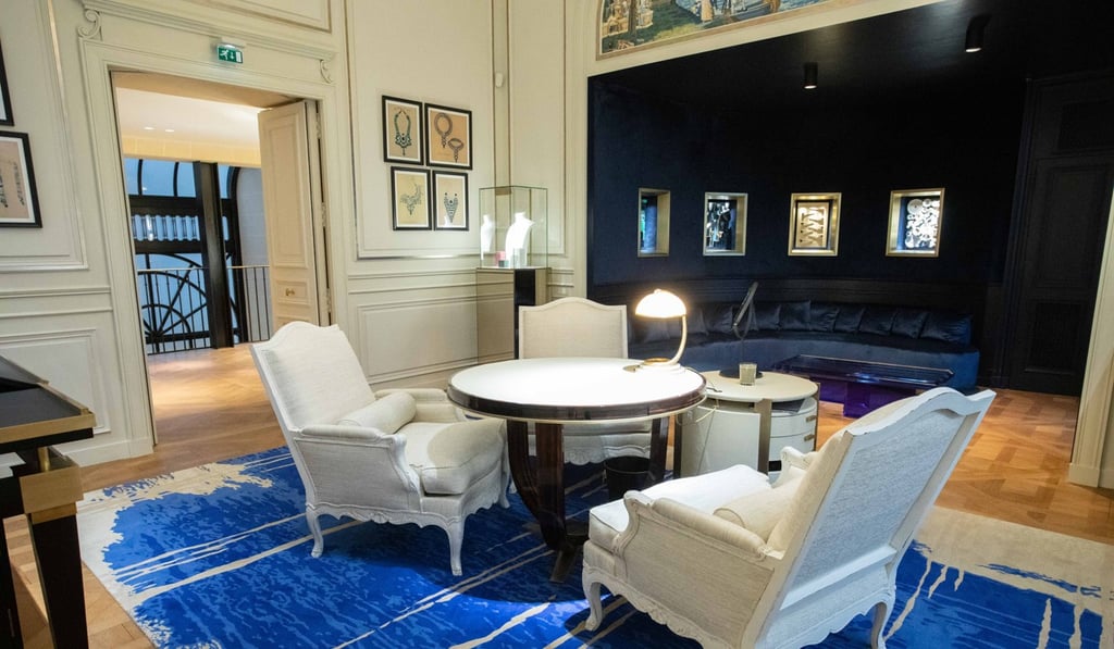 A lamp illuminates chairs and a table in a buyers’ area inside the Boucheron boutique. Photo: Christophe Morin/Bloomberg