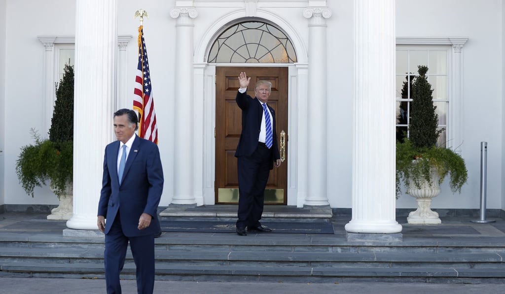 President-elect Donald Trump waves as Mitt Romney leaves Trump National Golf Club in Bedminster, New Jersey, on November 19, 2016. Photo: AP