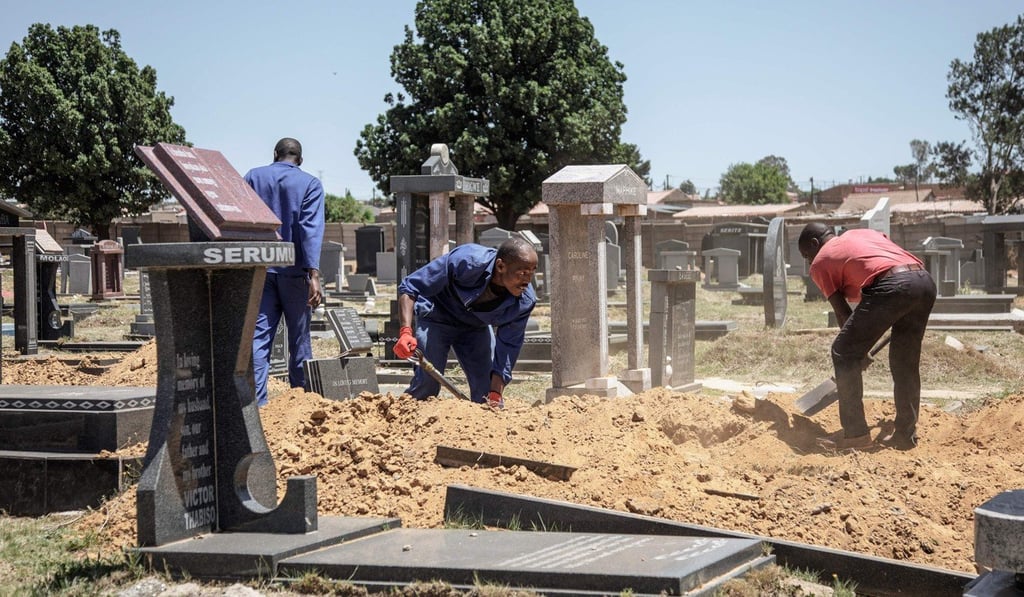 Workers digging a new grave at the Roodepoort cemetery on November 22, 2018 in Johannesburg, South Africa. Photo: AFP