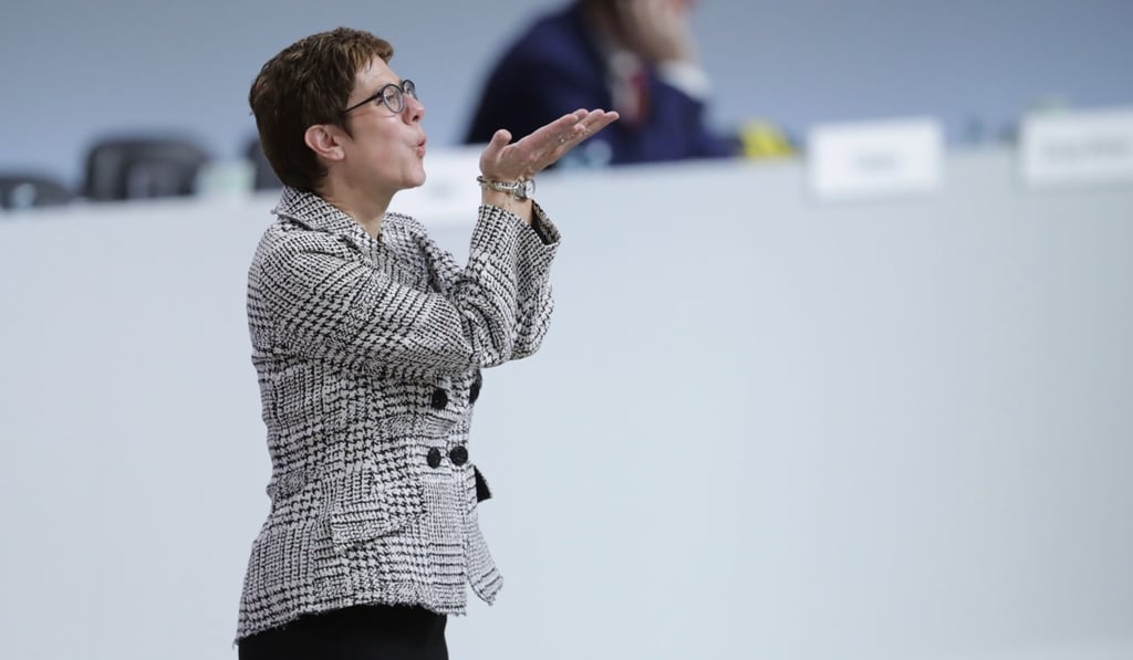 Annegret Kramp-Karrenbauer reacts on stage after she was elected as party leader. Photo: dpa via AFP
