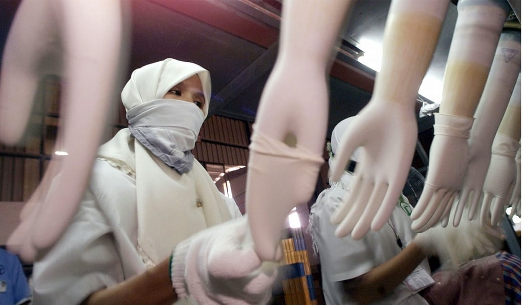 File photo of a worker in a Top Glove factory in Malaysia. Photo: AP