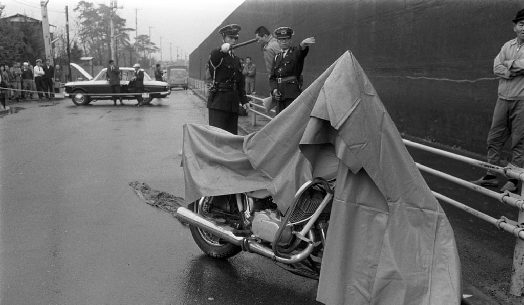 Police officers inspecting a motorcycle, which was used for Japan’s biggest ever cash heist. Photo: AFP Police officers inspecting a motorcycle, which was used for Japan’s biggest ever cash heist. Photo: AFP