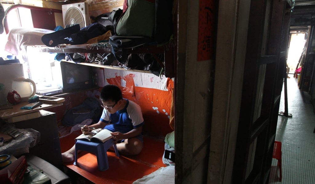 A primary school student does his homework in his 50 sq ft home. Photo: Dickson Lee