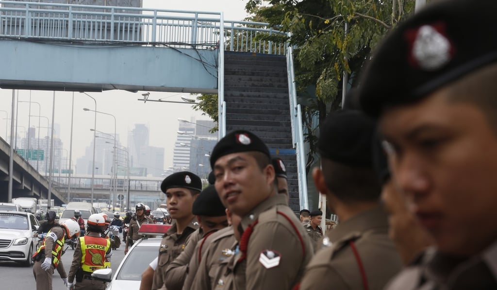 Thai police officers stand guard outside a meeting of the country’s political parties at the Royal Thai Army Club in Bangkok. Photo: EPA Thai police officers stand guard outside a meeting of the country’s political parties at the Royal Thai Army Club in Bangkok. Photo: EPA