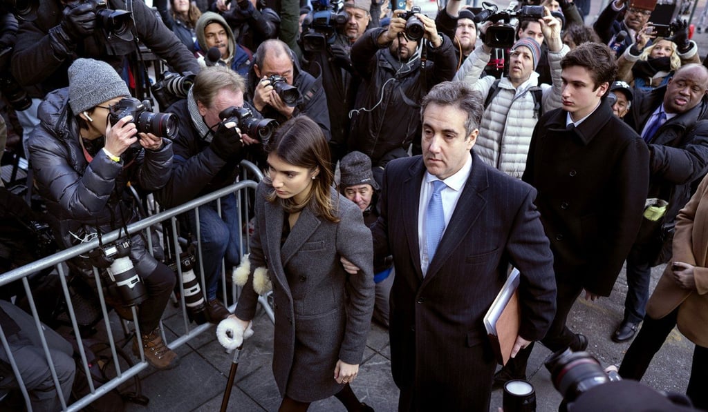 Michael Cohen, centre, President Donald Trump's former lawyer, accompanied by his children Samantha, left, and Jake, right, arrives at federal court for his sentencing on Wednesday in New York. Photo: AP Michael Cohen, centre, President Donald Trump's former lawyer, accompanied by his children Samantha, left, and Jake, right, arrives at federal court for his sentencing on Wednesday in New York. Photo: AP