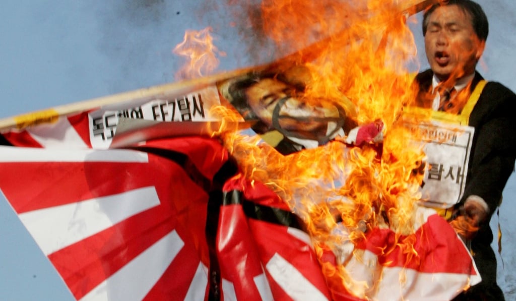 South Korean protesters burn a Japanese military flag in 2006. Photo: Reuters