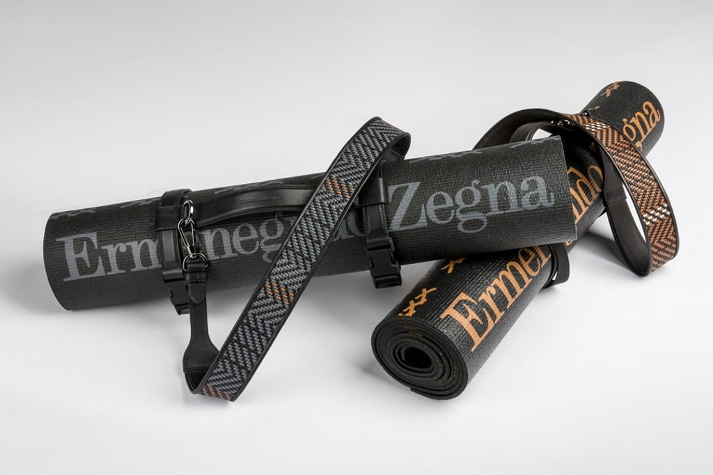 Zegna’s yoga mat is made of textured foam, while the crossbody strap is offered in steely grey or tawny vicuna brown stripes.