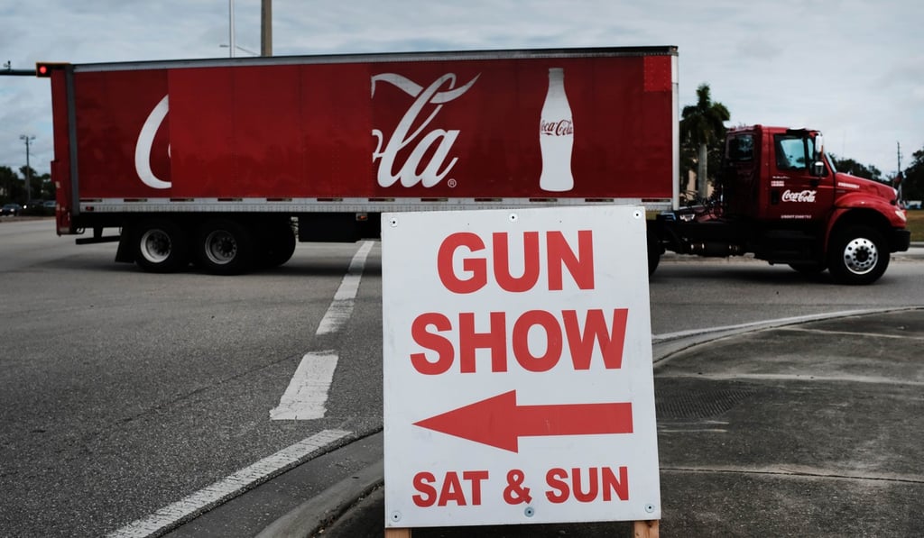 A sign stands outside of a gun show on November 24, 2018 in Naples, Florida. Photo: AFP