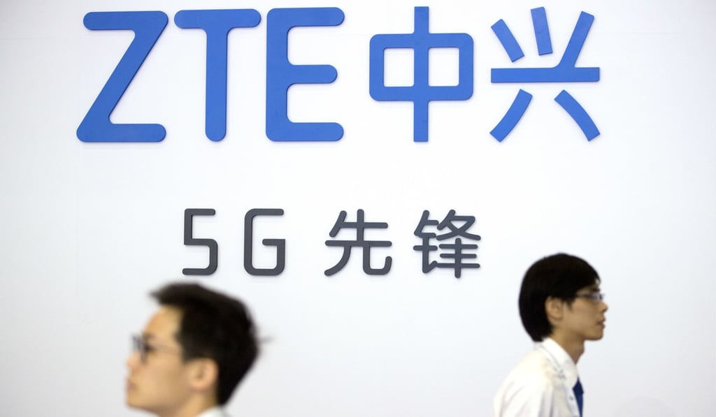 Visitors walk beneath the logo of Chinese technology firm ZTE at a tech expo in Beijing in September, in this file photo. Photo: AP Visitors walk beneath the logo of Chinese technology firm ZTE at a tech expo in Beijing in September, in this file photo. Photo: AP