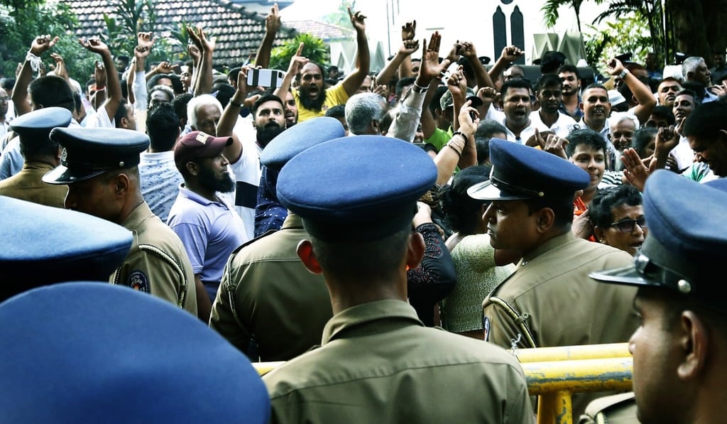 Sri Lankan political party supporters gather near the Supreme Court in Colombo. Photo: EPA