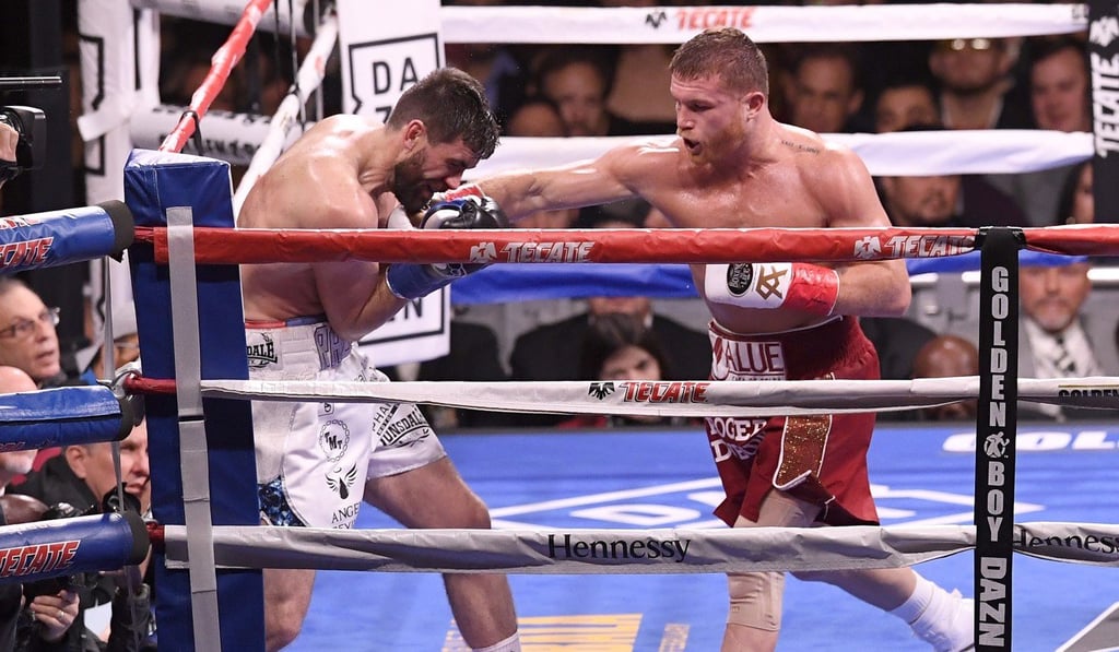 Rocky Fielding takes a straight right from Canelo Alvarez during their WBA Super Middleweight title bout. Photo: AFP Rocky Fielding takes a straight right from Canelo Alvarez during their WBA Super Middleweight title bout. Photo: AFP