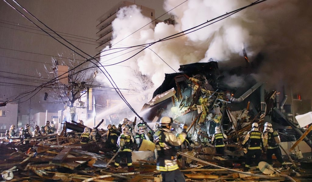 First responders work at the scene of an explosion in Sapporo, Japan. Photo: AP First responders work at the scene of an explosion in Sapporo, Japan. Photo: AP